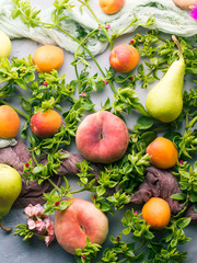 Fresh summer fruit concept still life - peaches, apricots and pears