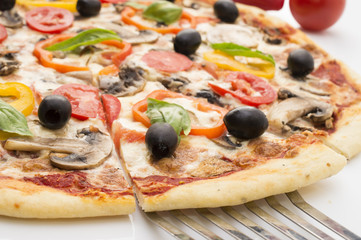 Pizza with ham, pepper and olives