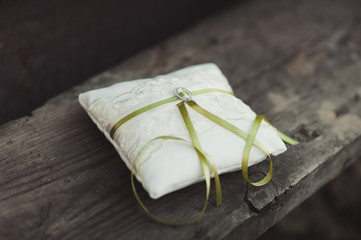 Two wedding rings on the pillow