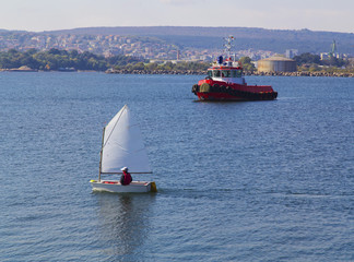 A tug ship in the blue sea