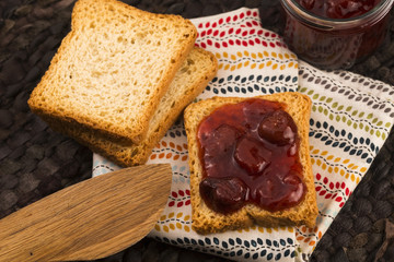 Breakfast of cherry jam on toast