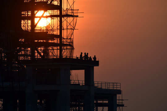 Silhouette building at construction site .