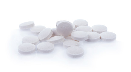 white pills isolated on white background