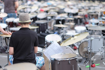 A young musician behind a drum set. Baltic Drum Summit 2017. Riga, Latvia.