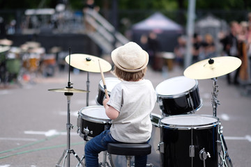 A little musician behind the drum set. Baltic Drum Summit 2017. Riga, Latvia.
