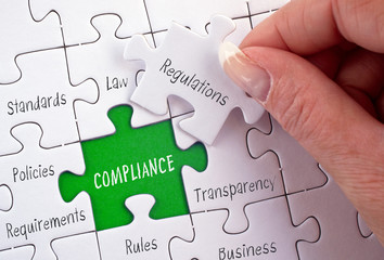 Compliance puzzle with female hand - policy, regulations, rule, requirement, instruction