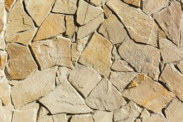 Obraz premium Multi-colored and multi-sized, orange and brown rock wall grunge texture background.