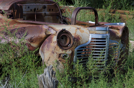 Rusted Out Car in a Field