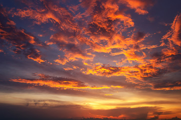 Fototapeta premium Sunset makes the sky and cloud a beautiful golden yellow.