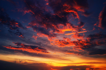 Sunset makes the sky and cloud  a beautiful golden yellow.