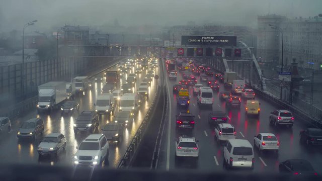 Rain in Moscow. View to traffic on the bridge
