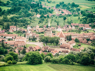 Obraz premium Saschiz Saxon Village in Transylvania, Romania with it's fortified church in the town center