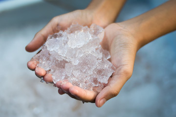 hand holding ice cubes