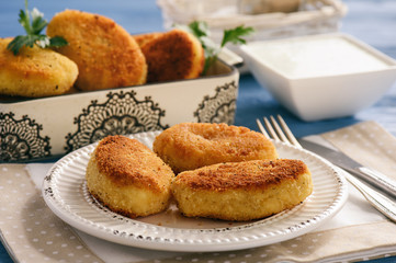 Potato croquettes stuffed with mozzarella and garlic sauce.