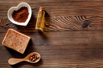 Homemade skin care. Coffee soap on wooden background top view copyspace