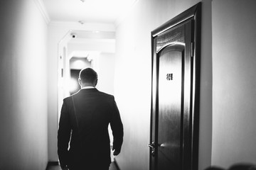 Fototapeta premium The handsome groom walking along