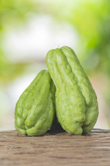 Sechium edule on a wooden floor and has a background of natur