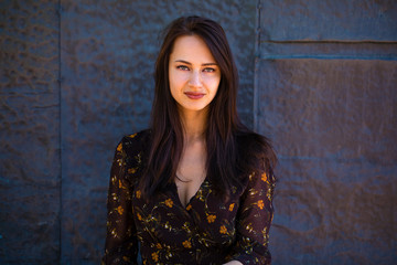 Fototapeta premium Beautiful brunette woman in sexy brown dress