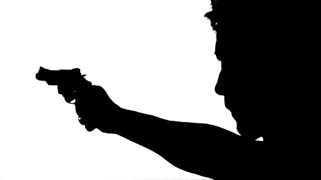 Silhouette of Man Holding Gun. Silhouette of a man aiming with a gun over white background