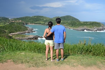 Couple hugging in brava beach, brazil