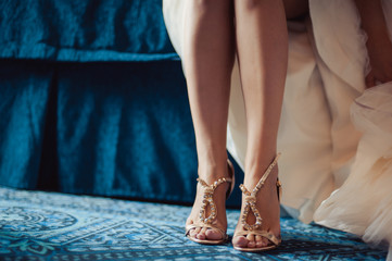Bride Putting On Wedding Shoes