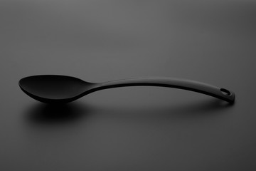 spoon over gray background