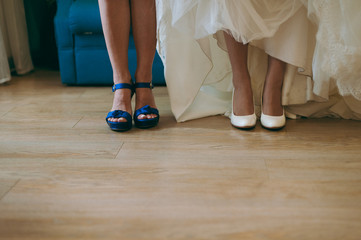 Bride Putting On Wedding Shoes