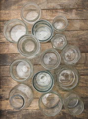 Clear glass jars for food preservative on wooden tray