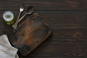Empty old cutting board over old wood background