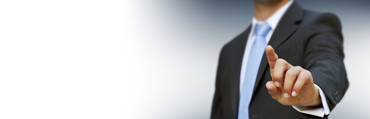 Panorama view of businessman pointing finger