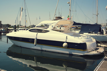 Fototapeta premium White yachts in the port waiting. On the sea is calm.