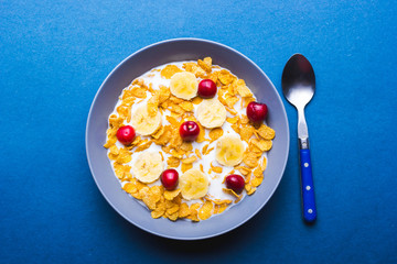 Bowl of cereal for breakfast on a blue background