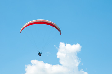 Paraglider flies paraglider in the sky. Paragliding.