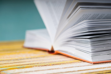 Open book on wooden table. Back to school. Copy space