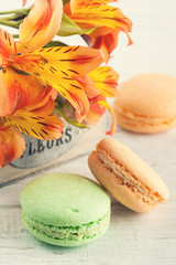 Orange macaroons, lily flowers