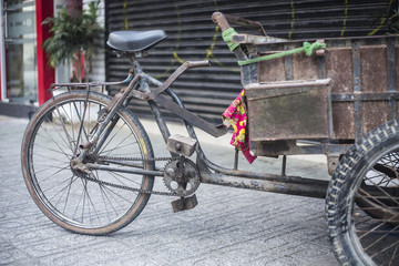 Fototapeta na wymiar Antique old cargo bicycles, cargo tricycles.