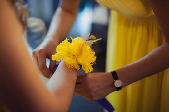 Flower on hand of the bridesmaids at the wedding