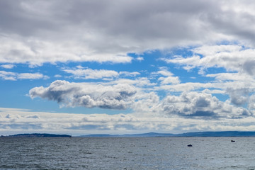 view of the ocean and a blue sky with clouds