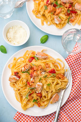 Pasta Tagliatelle with salmon fish and tomatoes
