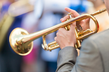 Fototapeta na wymiar Closeup of trumpet player's hands at Jazz Festival