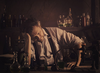 crazy medieval scientist working in his laboratory