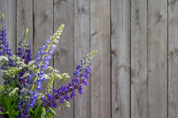 Flowers on the wooden background with copy space