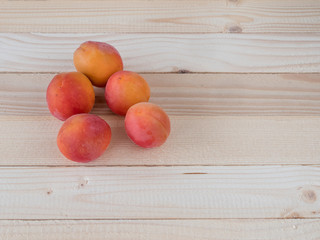 Apricots on a wooden table