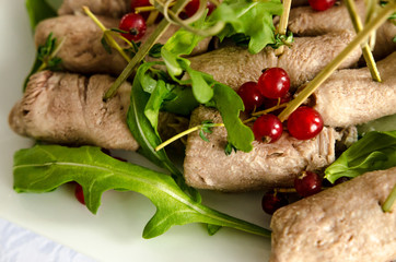 Beef meat roll with arugula and red currant