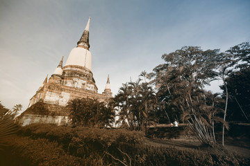 Ancient white buddha statues and ruined pagoda at Wat Yai Chai Mongkol in Ayutthaya historic attractions ,Thailand.