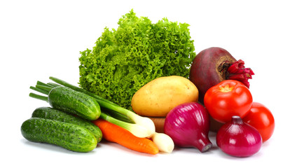 Assortment of fresh raw vegetables isolated on white background. Tomato, cucumber, onion, salad, carrot, beetroot, potato