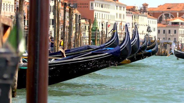 Swinging Venetian Gondolas in the Venice, Italy. Closeup Slow Motion Video.
