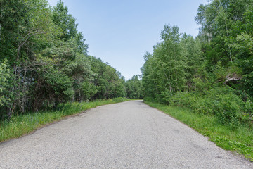 Road in mountain forest sky in East Kazakhstan Region.