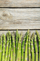 Fresh green asparagus on a grey wooden table