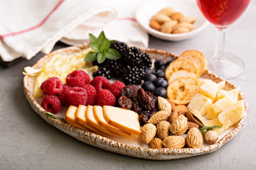 Cheese plate with nuts and berries